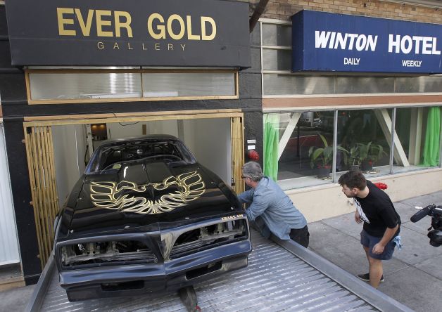 Guy Overfelt (left) and Ever Gold Gallery owner Andrew McClintock during the installation of "Free Bird: The Never Ending Joy Ride, 1998-2014."