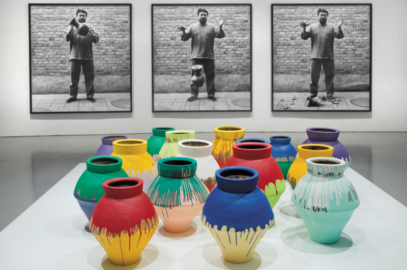 Ai Weiwei, "Colored Vases," 2007‒10. Han Dynasty vases and industrial paint, dimensions variable. Courtesy of Ai Weiwei Studio. Installation view of Ai Weiwei: According to What? at the Hirshhorn Museum and Sculpture Garden, Washington D.C., 2012. Photograph by Cathy Carver.