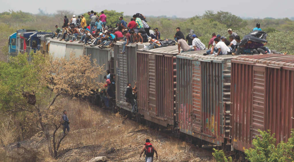 Central American migrants risk life and limb riding freight train wagons to reach the U.S. Courtesy of the Internet.