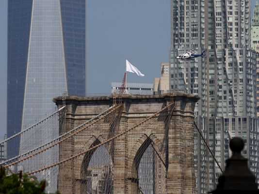 White Flags on top the Brooklyn Bridge, New York City, 2014. Photo by Andrew Gombert, European Pressphoto Agency.