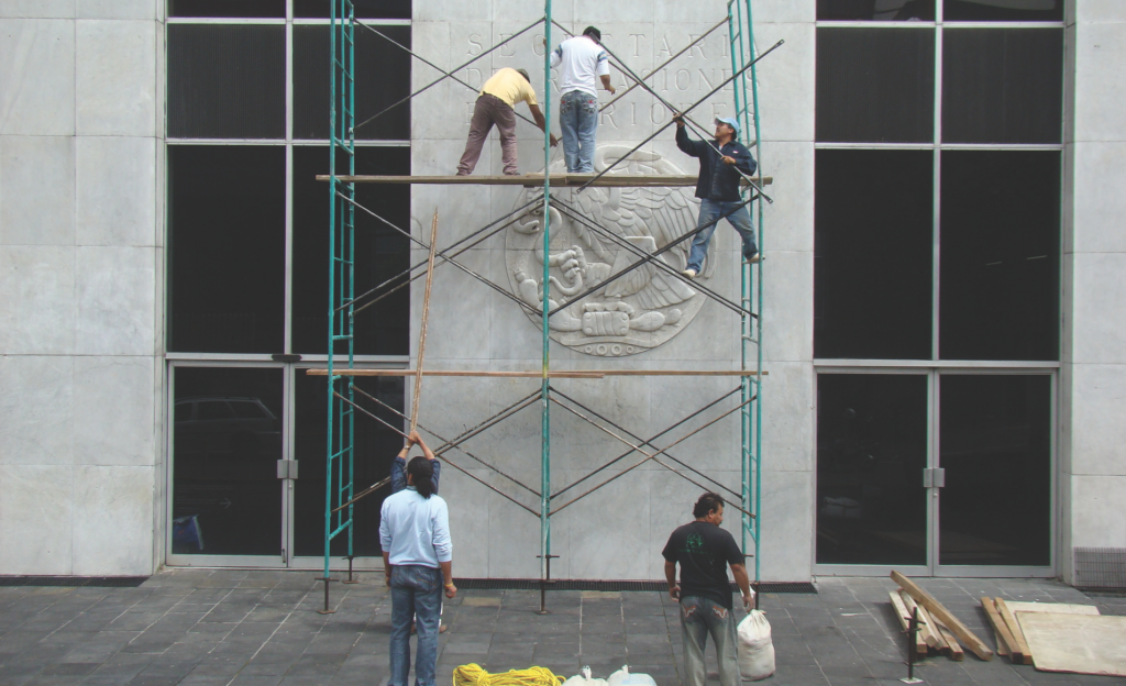 Dismantlement and Reinstallation of the National Coat of Arms, 2008. Intervention. Courtesy of the artists.