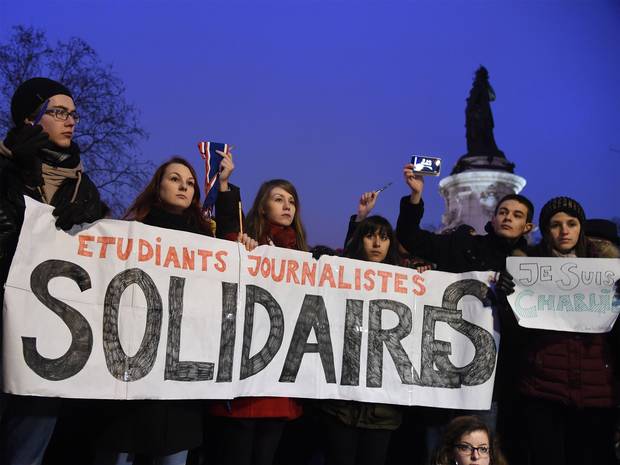 Students attend the masses holding a vigil at Place de la République in Paris on 07 January 2015. Image courtesy The Independent.