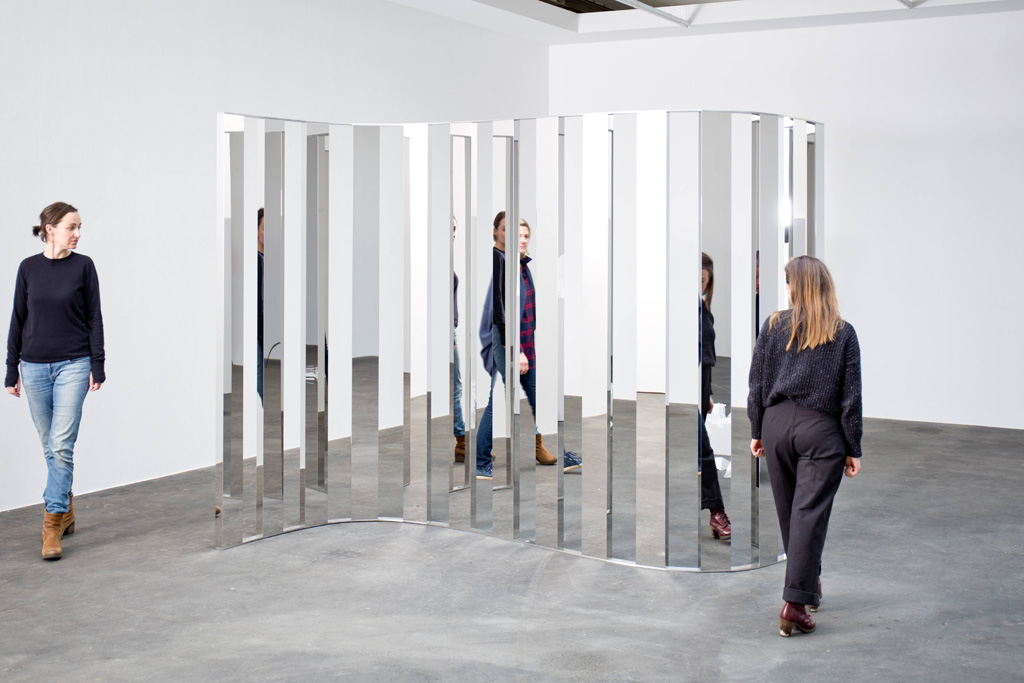 Jeppe Hein, Sine Curve I, 2015. High polished stainless steel, aluminum, edition of 3. 86 2/3 x 126 x 52 3/4 inches. Courtesy of 303 Gallery.