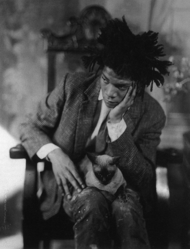 Jean-Michel Basquiat with his cat shortly before trading her for anti-depressants. 