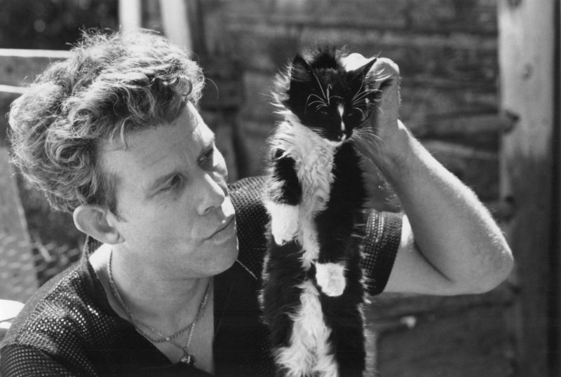 Tom Waits sizing up his cat Martha to exchange for a carton of cigarettes. 