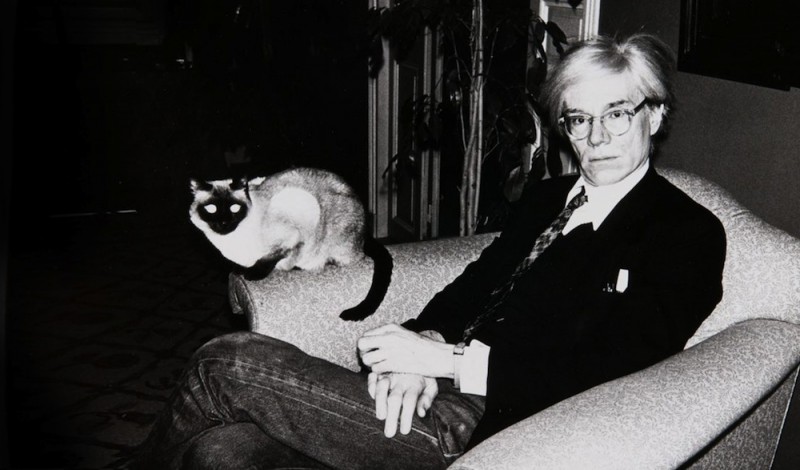 Andy Warhol with Sam, his cat and only lover.