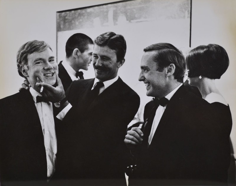 Julian Wasser. "Andy Warhol, Irving Blum, Billy Al Bengston and Dennis Hopper, at the Opening Reception, Duchamp Retrospective, Pasadena art Museum, 1963. Vintage gelatin silver print. 7.5 x 9.5”. Courtesy Robert Berman Gallery