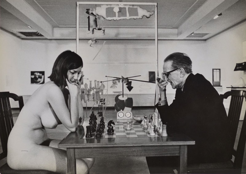 Julian Wasser. "Chess Match, Duchamp scratching nose," Duchamp Retrospective, Pasadena Art Museum, 1963 vintage gelatin silver print. 6.75 x 9.5”. Courtesy Robert Berman Gallery.