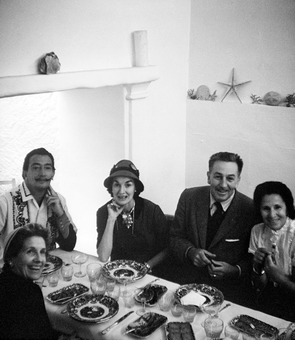 The Dalí and Disney families around the dinner table in Spain, 1957. Courtesy of The Walt Disney Company, © Disney.