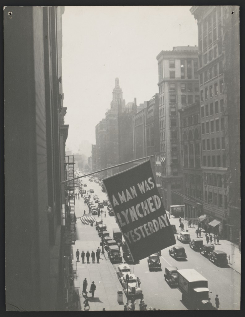 Flag, announcing lynching, flown from the window of the NAACP headquarters on 69 Fifth Ave., New York City, 1936. Photograph, 13 7/16 x 10 7/16 inches. Prints and Photographs Division, Library of Congress, Washington, D.C, LC-DIG-ppmsca-39304. Courtesy of The Crisis Publishing Co., Inc., the publisher of the magazine of the National Association for the Advancement of Colored People, for material first published in The Crisis. Courtesy of the Brooklyn Museum.