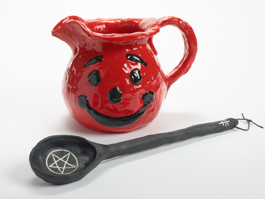 Mary Frey, Fight Evil, 2016. English porcelain, blood red and death metal engobe, luster, and resin, 7.5 x 10 x 6.5 inches (pitcher), 1.25 x 14 x 3 inches (spoon). $4,200 