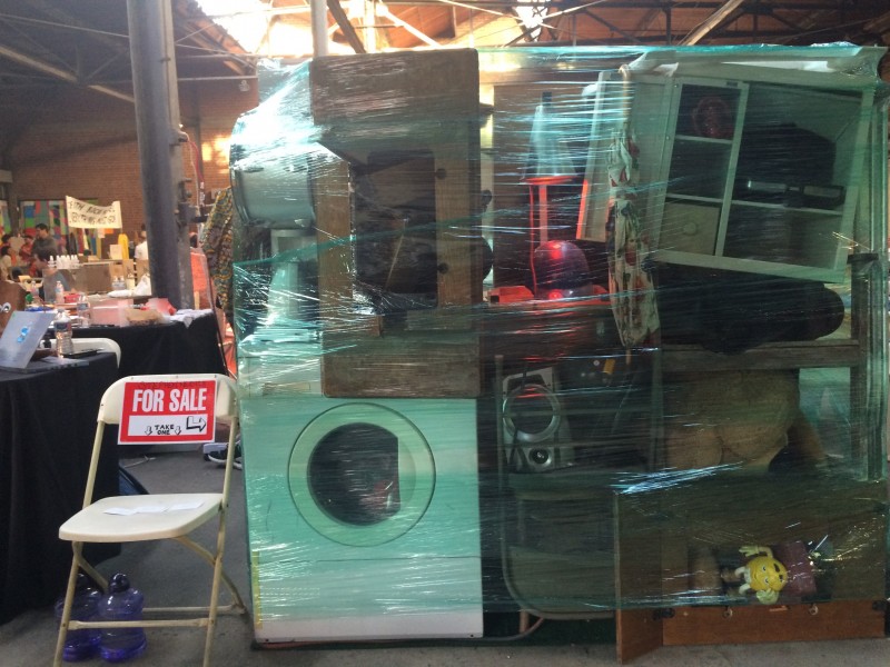 Saran wrapped sculpture at the Flea Market