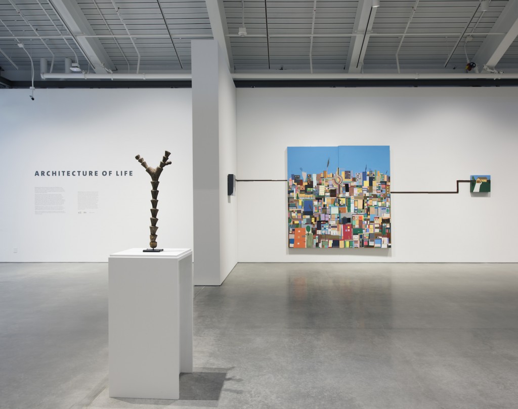 Architecture of Life, on view at the University of California, Berkeley Art Museum and Pacific Film Archive, January 31–May 29, 2016. Installation view, with a Dogon ritual altar ladder (left) and a work by Chris Johanson (right). Photograph by Sibila Savage. Courtesy of UC Berkeley Art Museum and Pacific Film Archive (BAMPFA).