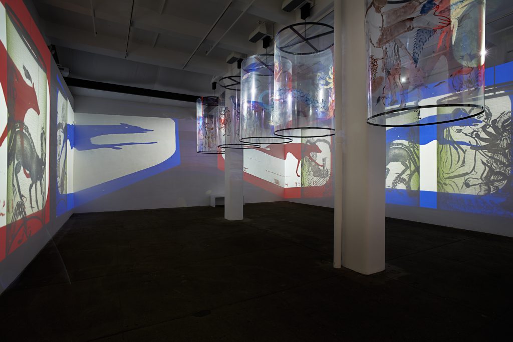 Nalini Malani, In Search of Vanished Blood, 2012, six-channel video (color, sound; 11:00 minutes) and five Mylar cylinders. Installation view, Nalini Malani: In Search of Vanished Blood, Galerie Lelong, New York, 2013. Courtesy Galerie Lelong, New York and Paris. © 2016 Nalini Malani