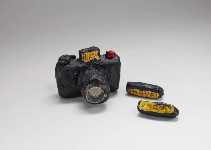 Untitled (Nikon), 1974. Clay and paint, 3 x 2.5 x 2 inches. Courtesy of the artist.