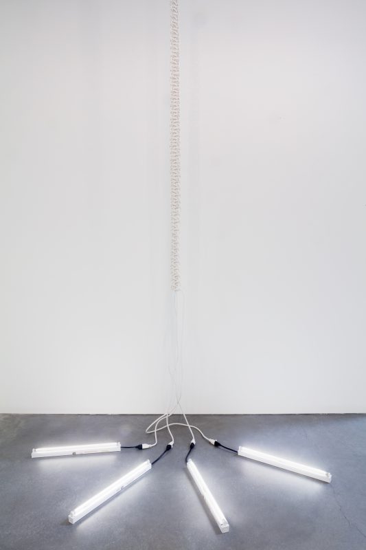 Dana Hemenway. Untitled (White Macrame Chain), 2016; White extension cords, powerstrip, paint, fluoresent light bulbs; edition 1 of 3; 204 x 48 x 3 inches. Courtesy of the artist and Eleanor Harwood Gallery, San Francisco.