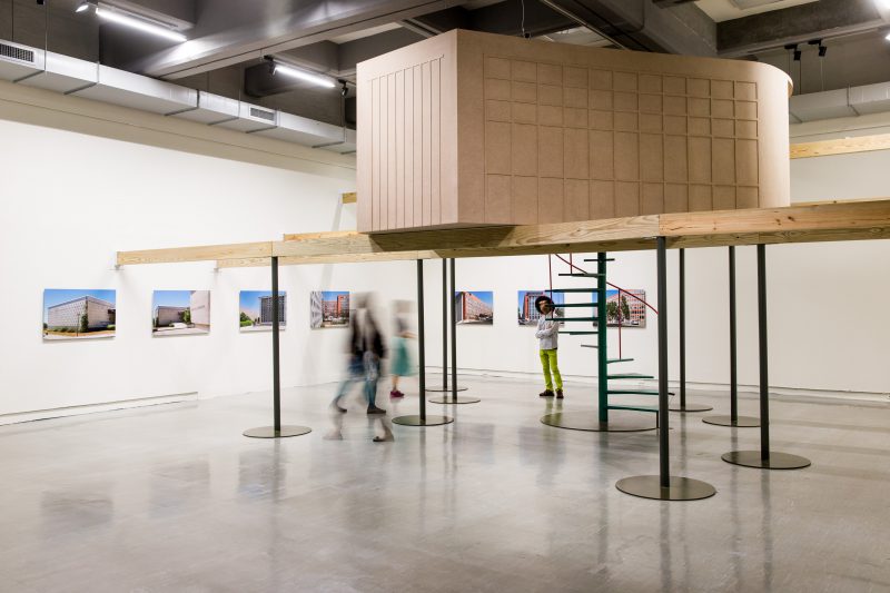 Ȃngela Ferreira, A Tendency to Forget, 2015. MDF, pine beams, iron, LCD, 460 x 565 x 415 cm. 7 inkjet prints, 70 x 100 cm each. Video, 16:9, color, sound, 19 min 15 sec, loop. Courtesy Taipei Fine Arts Museum.