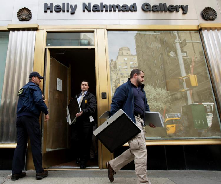 Federal agents remove computers from New York’s Helly Nahmad Gallery located inside the Carlyle Hotel on April 30th, 2014. Courtesy of the Internet.