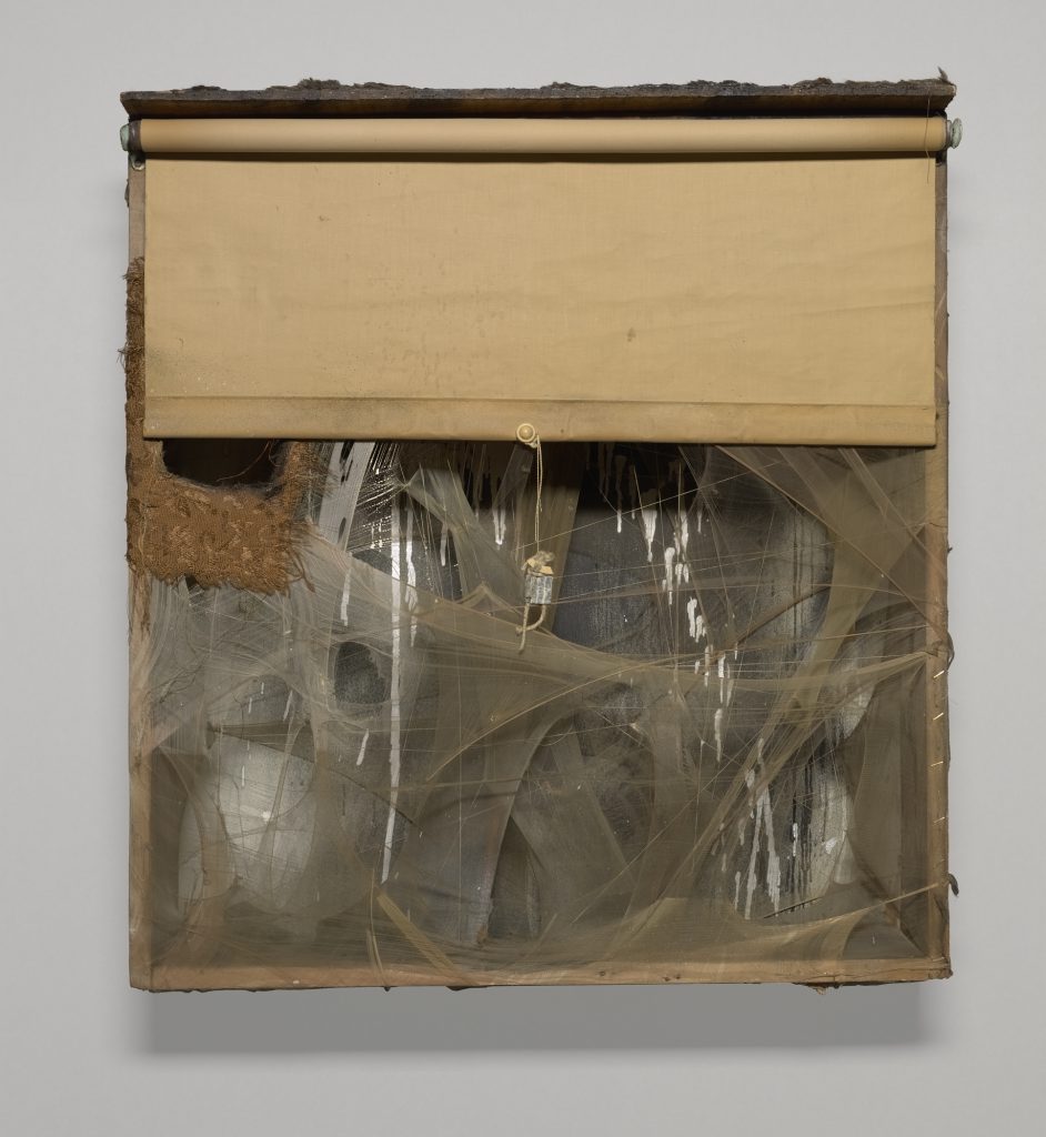 SPIDER LADY NEST, 1959; Wood box with aluminum paint, spray paint, window shade, nylon, thread, fabric, fur, lead customs seal on string, pearl bead, cotton ball, feathers, tassels, and cardboard; 31 x 28 1/2 x 7 in. (78.74 x 72.39 x 17.78 cm); Yale University Art Gallery, New Haven, Connecticut. Richard Brown Baker, BA 1935, Collection; © 2016 Conner Family Trust, San Francisco / Artists Rights Society (ARS), New York.