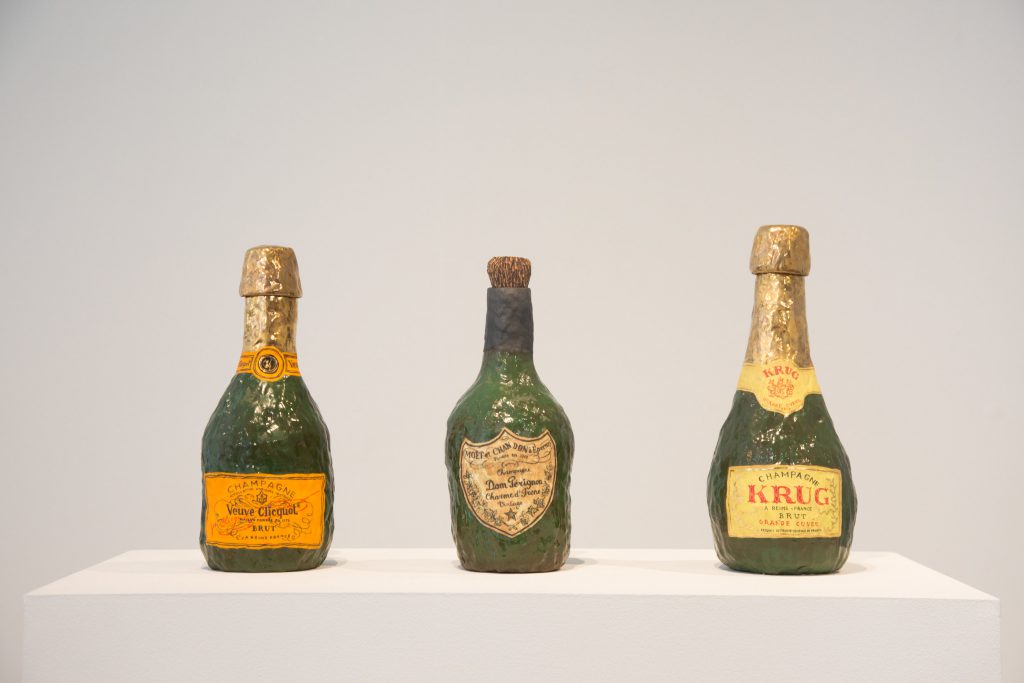 Veuve Clicquot; Krug; Dom Perignon, all 2016. Glazed porcelain, luster, and cork. Courtesy of A+E Studios.